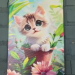 настінна картина зображено кошеня в горщику